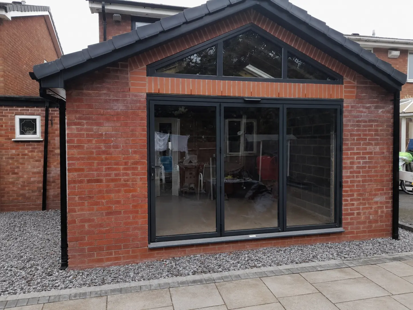 Black aluminium glazed doors and gable window installation