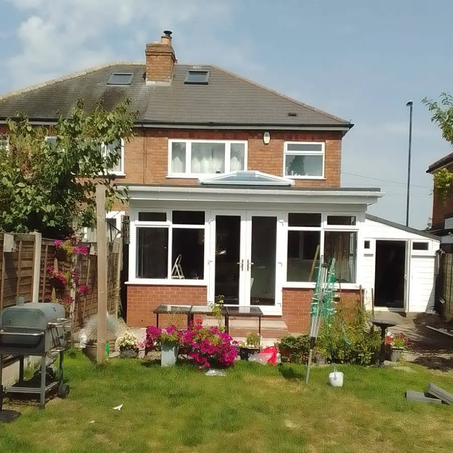 White windows and French doors fitted to rear extension