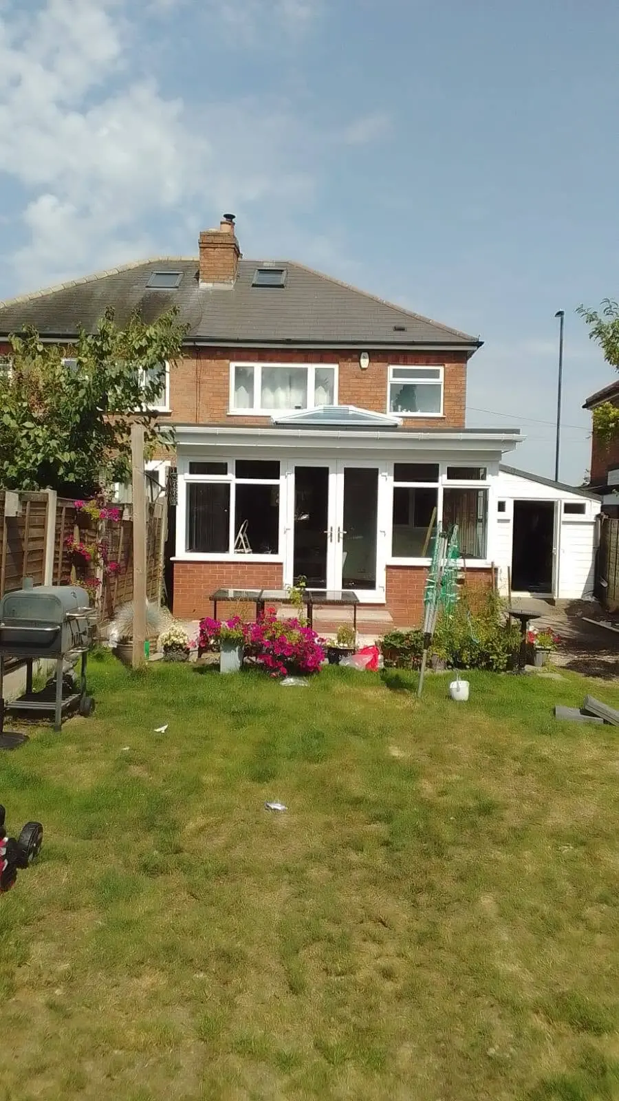 White conservatory installation with French doors